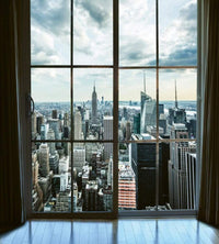 Dimex Manhattan Window View Fotobehang 225x250cm 3 banen | Yourdecoration.nl